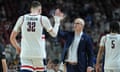 Dan Hurley high fives center Donovan Clingan during this year’s NCAA Tournament, which UConn won