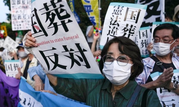 People protest against the state funeral for former Japanese prime minister Shinzo Abe in front of parliament buildings in Tokyo.