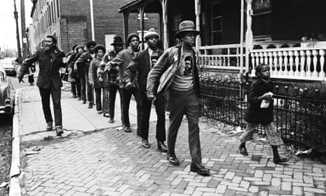 Khalid Raheem, at front of line, marching with the Black Panthers.