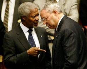 Then UN secretary general Kofi Annan speaks with Powell in the UN security council chamber