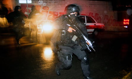 A state police officer during a confrontation with members of a gang in the neighbourhood of Casa Blanca in Xalapa in Veracruz state.