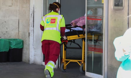A patient is wheeled into the emergency unit at Madrid’s 12 de Octubre hospital.