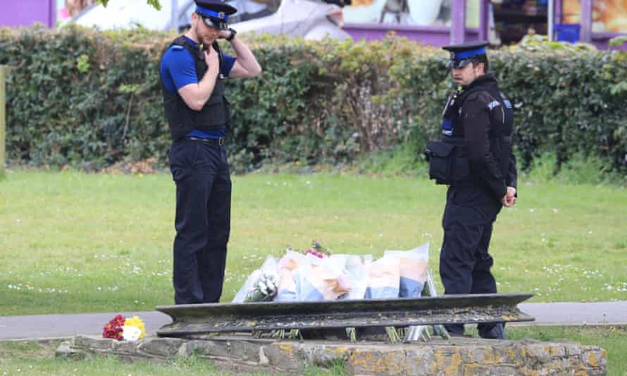 Police community support officers looked at flowers and messages left in memory of Julia James on Thursday.