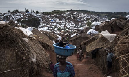 A Congolese woman walks through a camp for internally displaced people in Kalemie, in the DRC’s Tanganyika province, where conflict displaced 650,000 people at one point.
