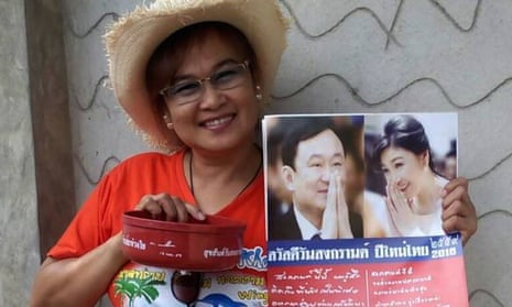 Theerawan Charoensuk, who has been charged with sedition in Thailand because the bowl she is holding bears a greeting from the former prime minister, Thaksin Shinawatra.