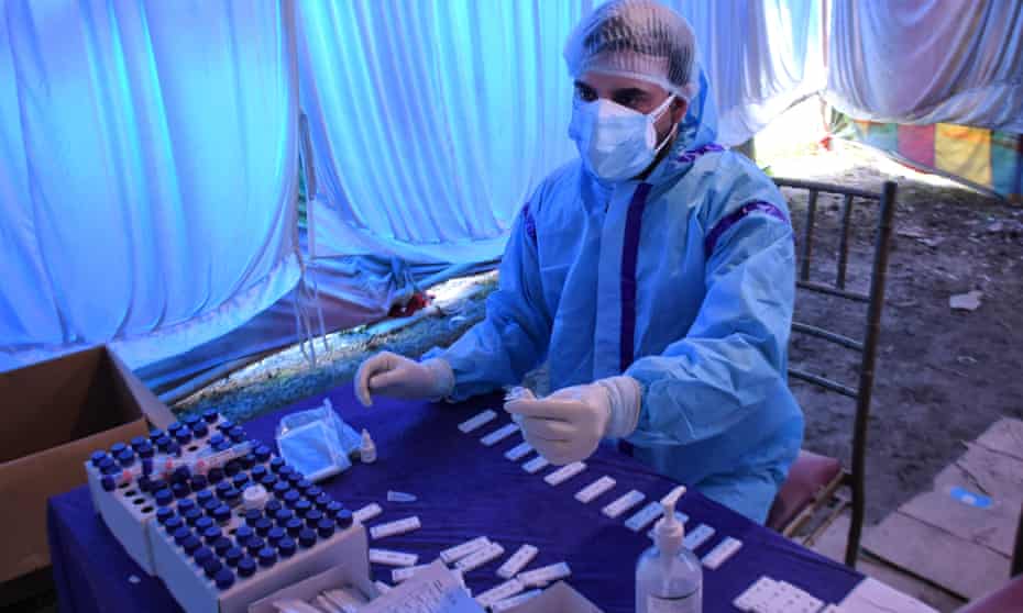 Covid-19 samples being prepared at a testing centre in Srinagar, India, on 21 April
