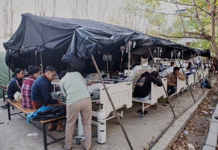 Patients receive treatment inside a makeshift tent outside a hospital in Labuan Bajo, East Nusa Tenggara province.