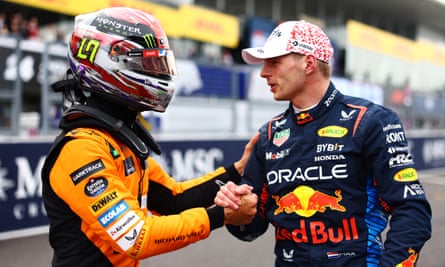 Max Verstappen and Lando Norris shake hands during qualifying ahead of the Japanese Grand Prix at Suzuka Circuit on 6 April 2024 in Suzuka