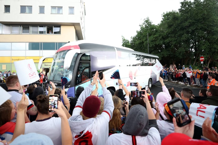 England supporters greet their team as their coach arrives at Bramall Lane.