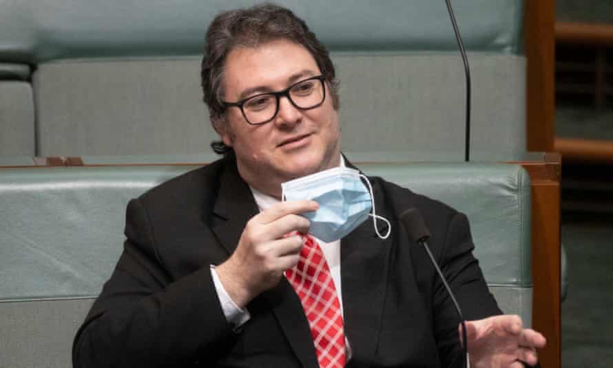 George Christensen takes his mask off during question time in the House of Representatives 