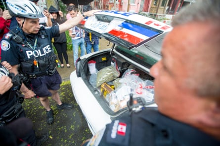 Police seize marijuana from a dispensary in Toronto.