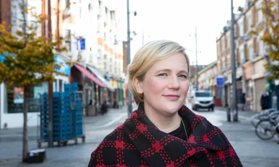 Stella Creasy in a street with shops behind her