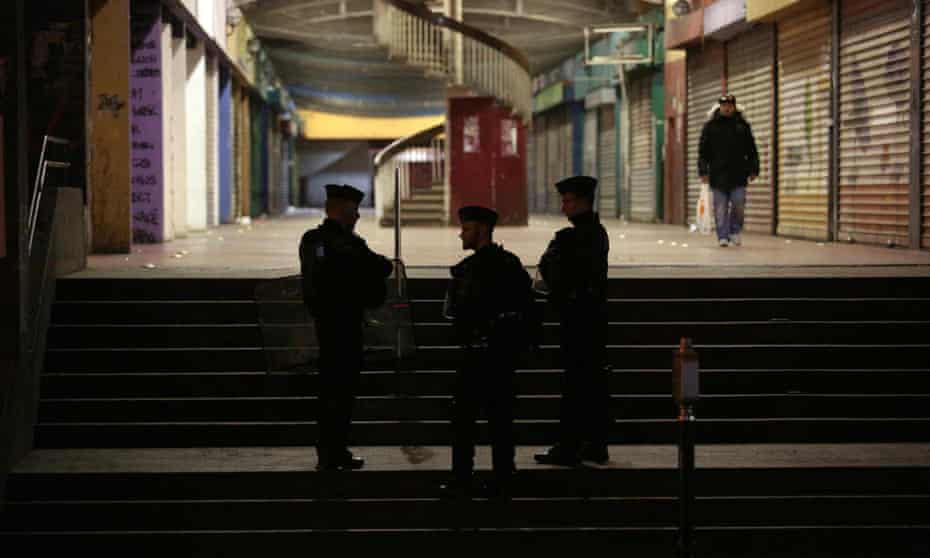 Police stand guard in the Rose-des-Vents district also known as the 3,000 estate in Aulnay-sous-Bois.