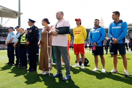 Community responders, including Chaya Dadon (fifth from left) and Ahmed al-Ahmed (middle), stand after receiving a guard of honour for their service during the Bondi attacks.