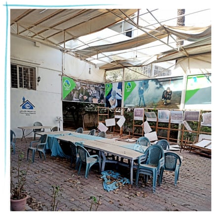 The abandoned courtyard of Press House, with dust-covered plastic seats and table