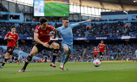 Manchester United’s Harry Maguire and Manchester City’s Phil Foden battle for the ball at the Etihad Stadium in March.