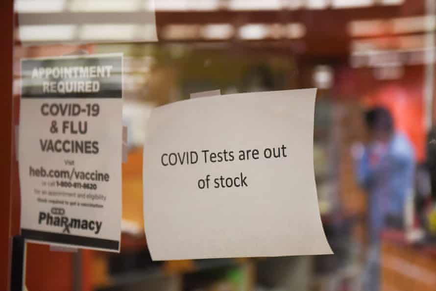 A sign in the window of a HEB pharmacy in Texas says "Covid tests are not available."