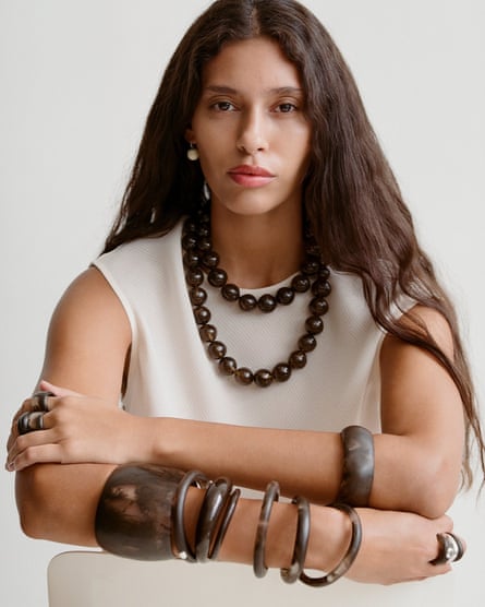 model wearing chunky necklace and bracelets