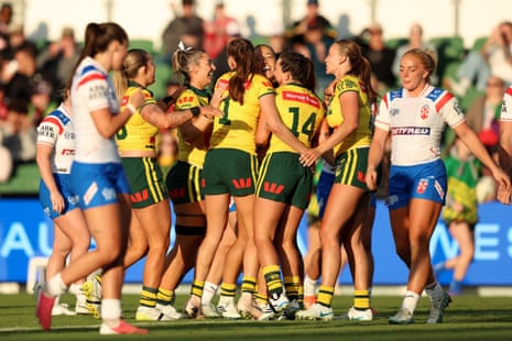 Australia celebrate as they open up a commanding lead over England during the women's Rugby League World Cup match at HBF Park