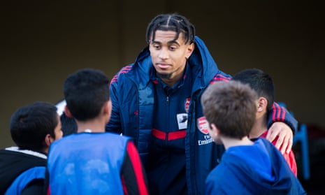 Reiss Nelson opens an artificial pitch at a London primary school. ‘We had the gravel, the ones with little stones in it, so when you fall you get it in your knees and palms,’ he says.