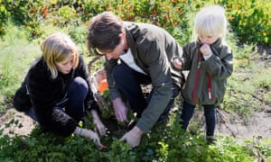 Gardening with his daughters.