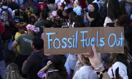 Sign reading "fossil fuels out"  during a demonstration at the Cop27 UN climate summit.