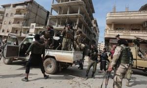 Turkey-backed Syrian rebel army soldiers take control of Afrin in northern Syria.