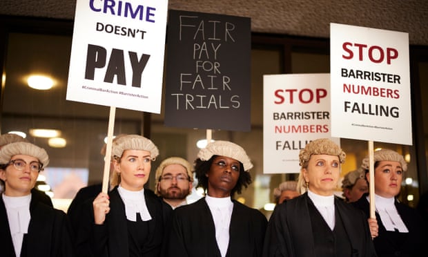 Barristers strike outside Manchester crown court over  legal aid fees.