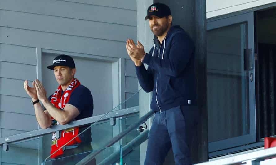 Wrexham co-owners, Ryan Reynolds and Rob McElhenney, look dejected as they watch Grimsby beat them in the playoffs.