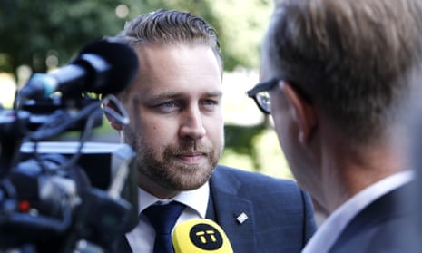 Mattias Karlsson, leader of the Sweden Democrats parliamentary group, talks to reporters.
