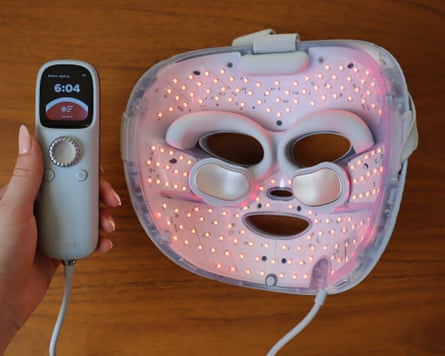 Closeup of the back Shark CryoGlow LED face mask and its controller unit.