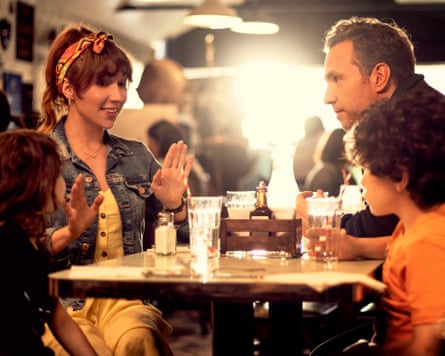 couple at table with two children