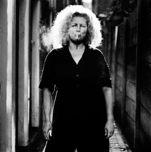 Marlene Dumas, Amsterdam 2000Often shooting his subjects in grungy urban environments or under lowering grey skies, Corbijn uses a slow shutter speed to capture gestures and movements in a unique photographic form that gives his work its gritty, edgy signature and reportage feel.
