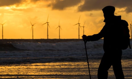 A female walker on Seaton Carew beach. The PM will compare the UK’s offshore wind resources to Saudi oil wealth at the Tory conference.