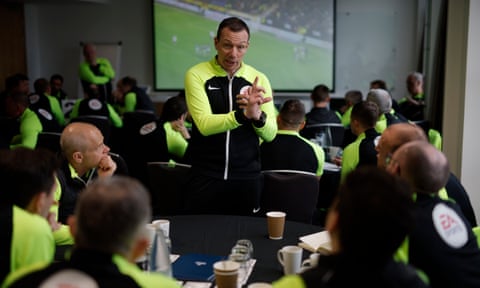 Kevin Friend makes a point during a discussion with referees at a training day at St George's Park