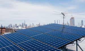 solar panels on a brooklyn roof with the manhattan skyline in the background
