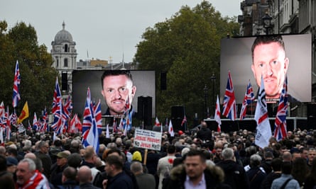 Tommy Robinson, displayed on two screens at an anti-immigration protest in London, 26 October.
