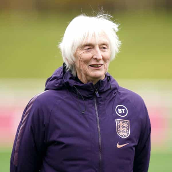 Baroness Sue Campbell half-smiling in a hoodie watching a training session in November 2021