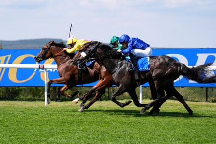 Kaiya Fraser and Dr Rascal (left) find a way through for victory at Goodwood