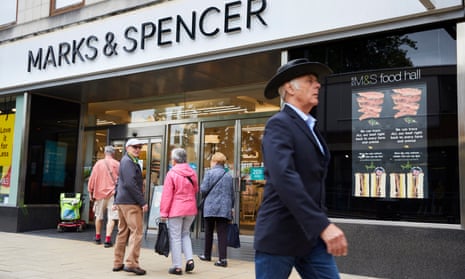 Exterior of Marks & Spencer Darlington with a man in a hat walking past