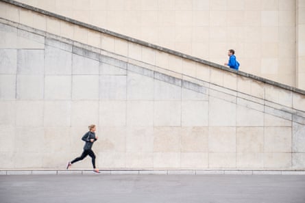 Stock pic of two runners, one running on the ground, one running up a flight of stairs.