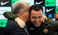 Xavi is embraced by Barcelona’s president, Joan Laporta