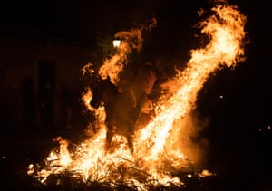 After jumping the horses over the flames, revellers spend the evening dancing and drinking