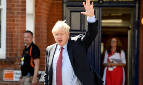 Boris Johnson waving as he leaves following a visit to Torbay Hospital.