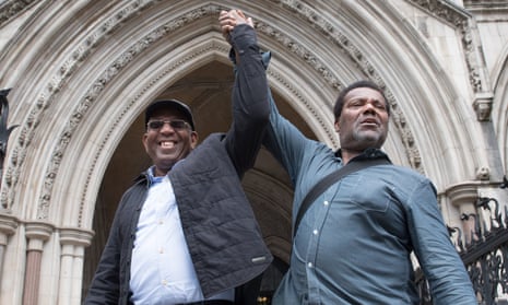 Paul Green and Cleveland Davidson celebrate having their convictions overturned in July 2021
