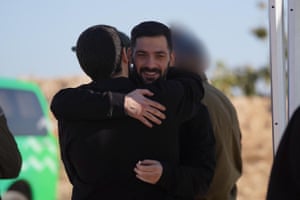 Gali Berman, facing the camera, hugs his brother Zivl