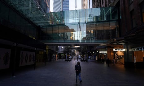 A man wears a protective face mask at the unusually quiet Pitt Street Mall in the City Centre of Sydney, during a lockdown to curb the spread of the coronavirus.