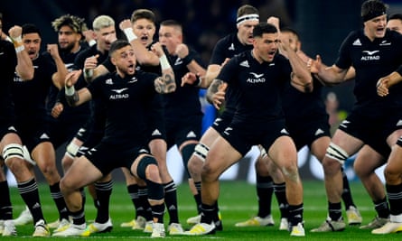 The New Zealand players perform the haka before the match