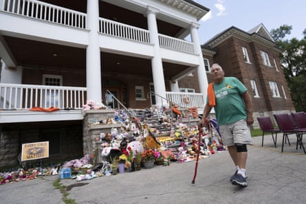 John Elliott, a survivor of the Mohawk Institute residential school, walks away after a press conference in front of the school in Brantford, Ont.