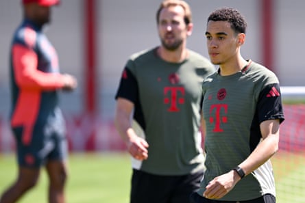 Jamal Musiala is followed by teammate Harry Kane during training